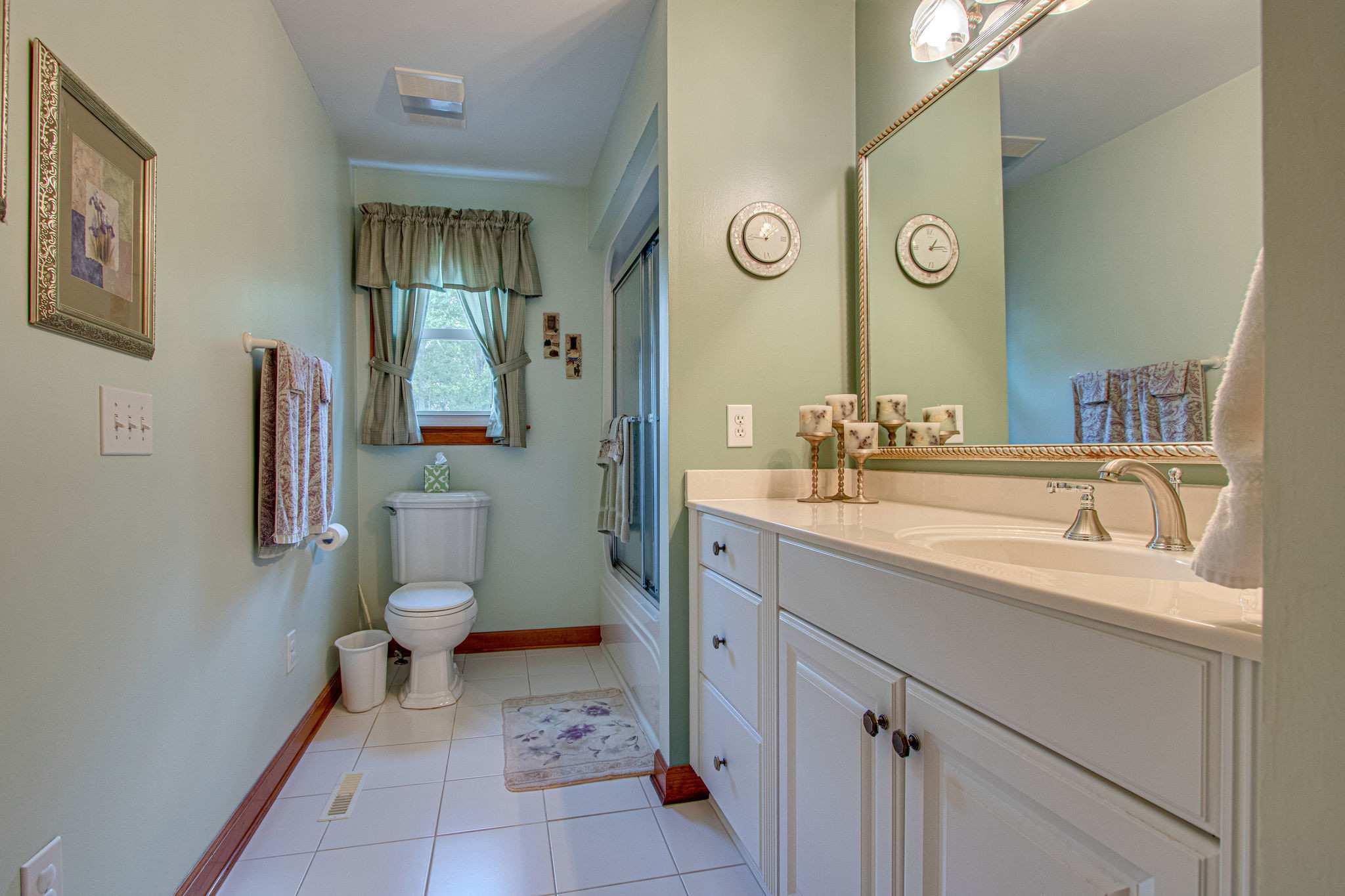 1802 Palmer Road Lebanon, TN 37090 - Photo 25 of 28 a bathroom with a sink and a mirror