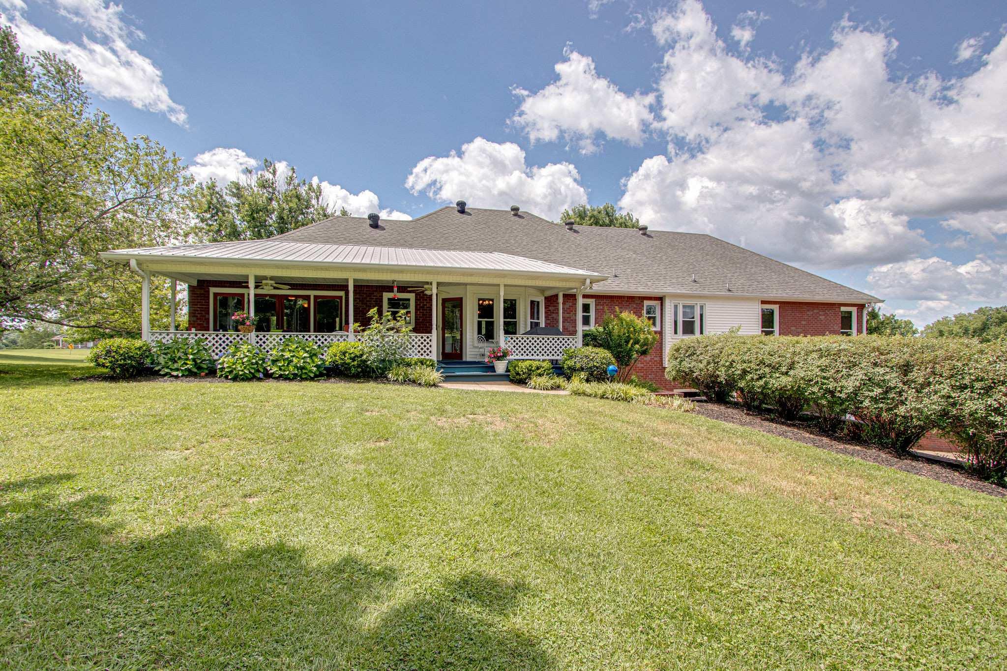 1802 Palmer Road Lebanon, TN 37090 - Photo 9 of 28 a view of a house with swimming pool and porch