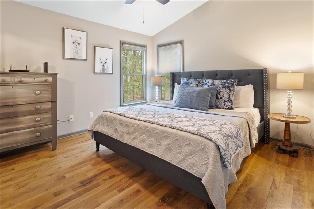 253 Zenith Trail Ellijay, GA 30540 - Photo 12 of 34 a bedroom with a bed and a dresser