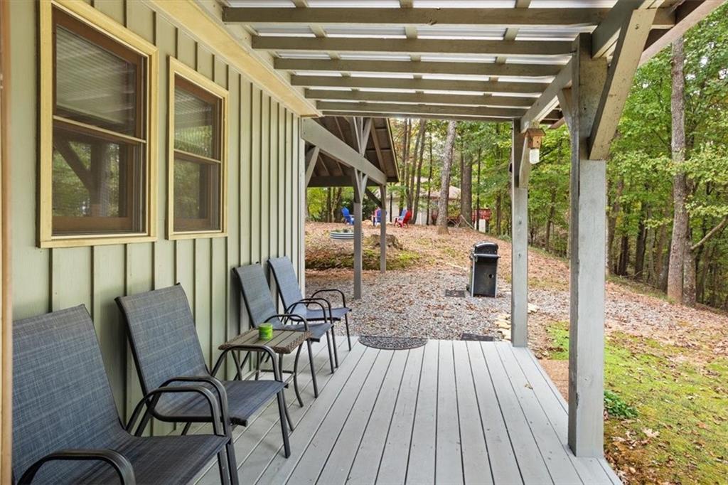 253 Zenith Trail Ellijay, GA 30540 - Photo 16 of 34 a view of a porch with a table and chairs