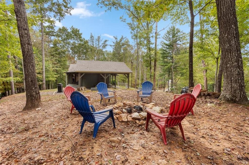 253 Zenith Trail Ellijay, GA 30540 - Photo 28 of 34 a view of a wooden chairs and table in backyard