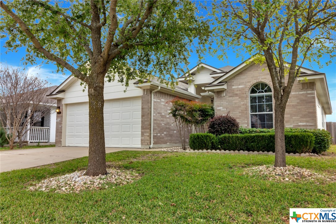 313 Shale Drive Jarrell, TX 76537 - Photo 1 of 1 a front view of a house with garden