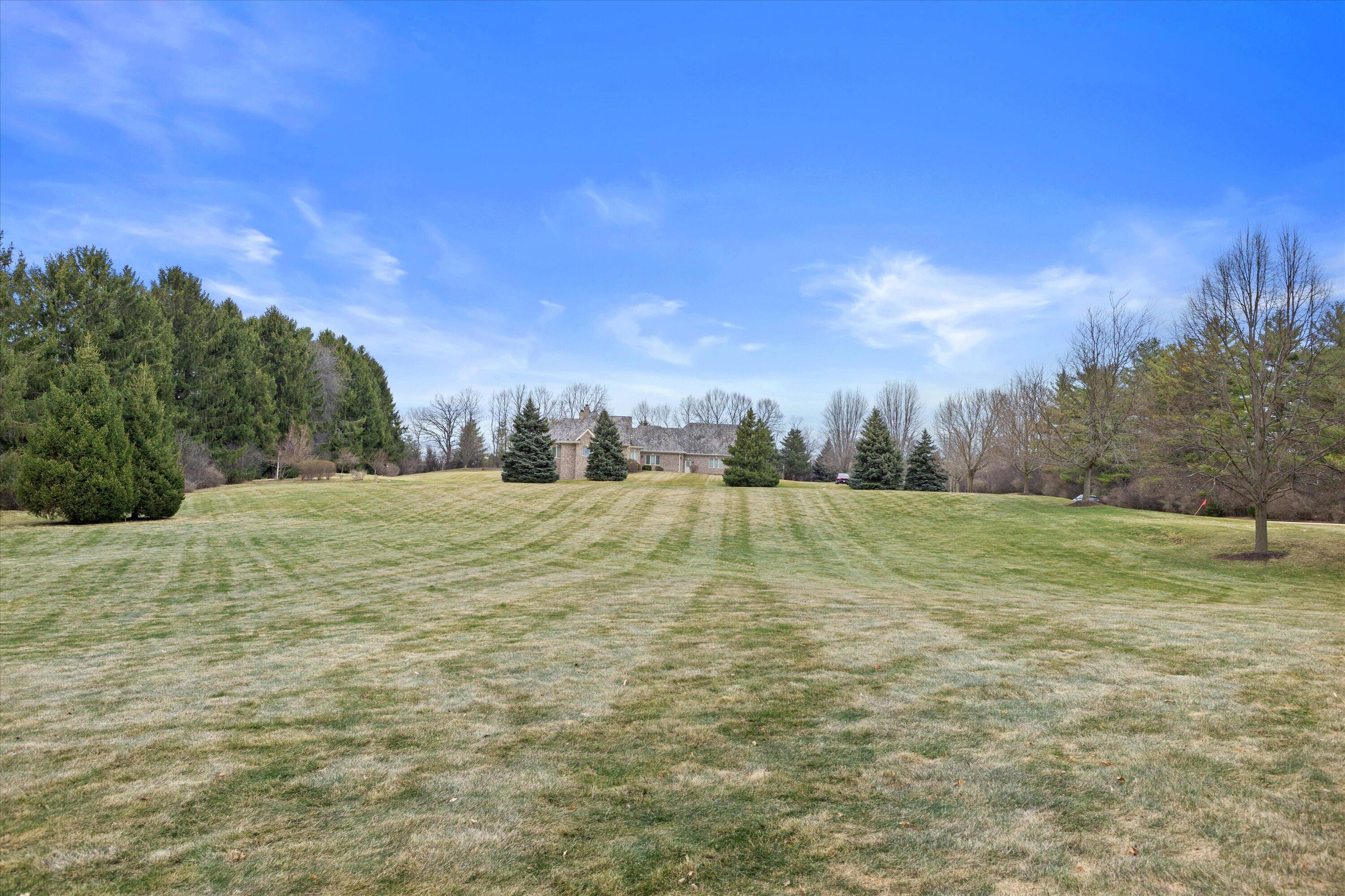 13965 North Pine Bluff Road Mequon, WI 53097 - Photo 10 of 14 Mature trees peppered throughout