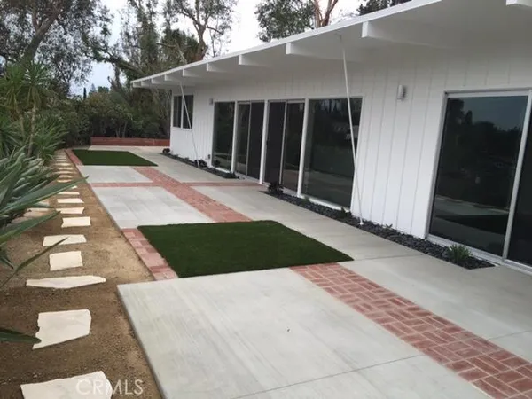 a view of backyard with garage