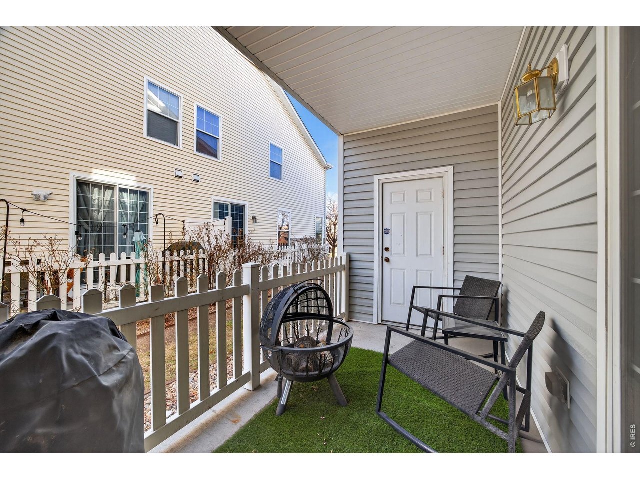 4775 Flower Street Wheat Ridge, CO 80033 - Photo 15 of 18 Private patio with additional secure storage closet.