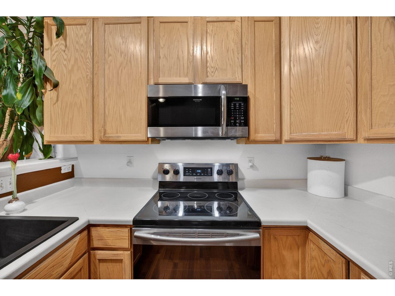 4775 Flower Street Wheat Ridge, CO 80033 - Photo 8 of 18 Newer appliances soft close cabinets with thoughtfully placed pull outs.