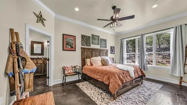 a bed room with a bed and a chandelier