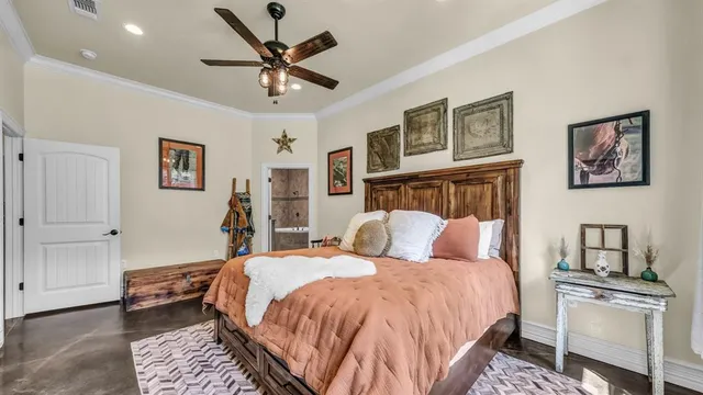 a bedroom with a bed and a chandelier