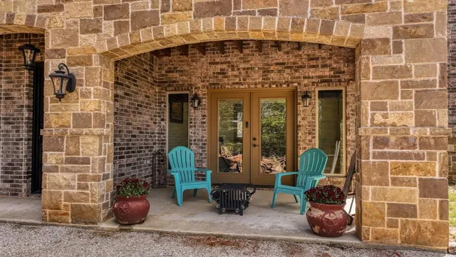 a front view of a building with outdoor seating