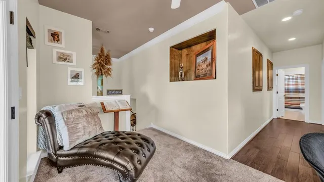 a bedroom with furniture and wooden floor