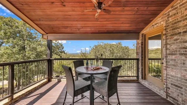 a view of a balcony with furniture