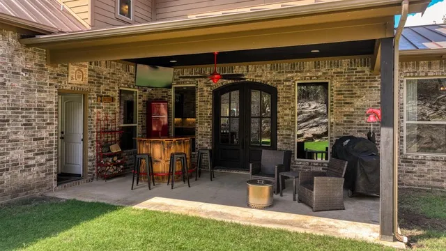 a view of a chairs and table in a patio