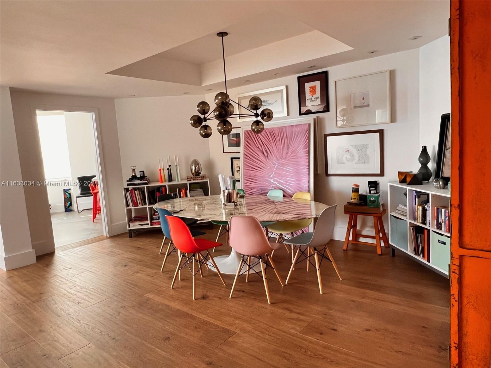 848 Brickell Key Drive, Unit 3701 Miami, FL 33131 - Photo 14 of 84 a view of a dining room with furniture and wooden floor