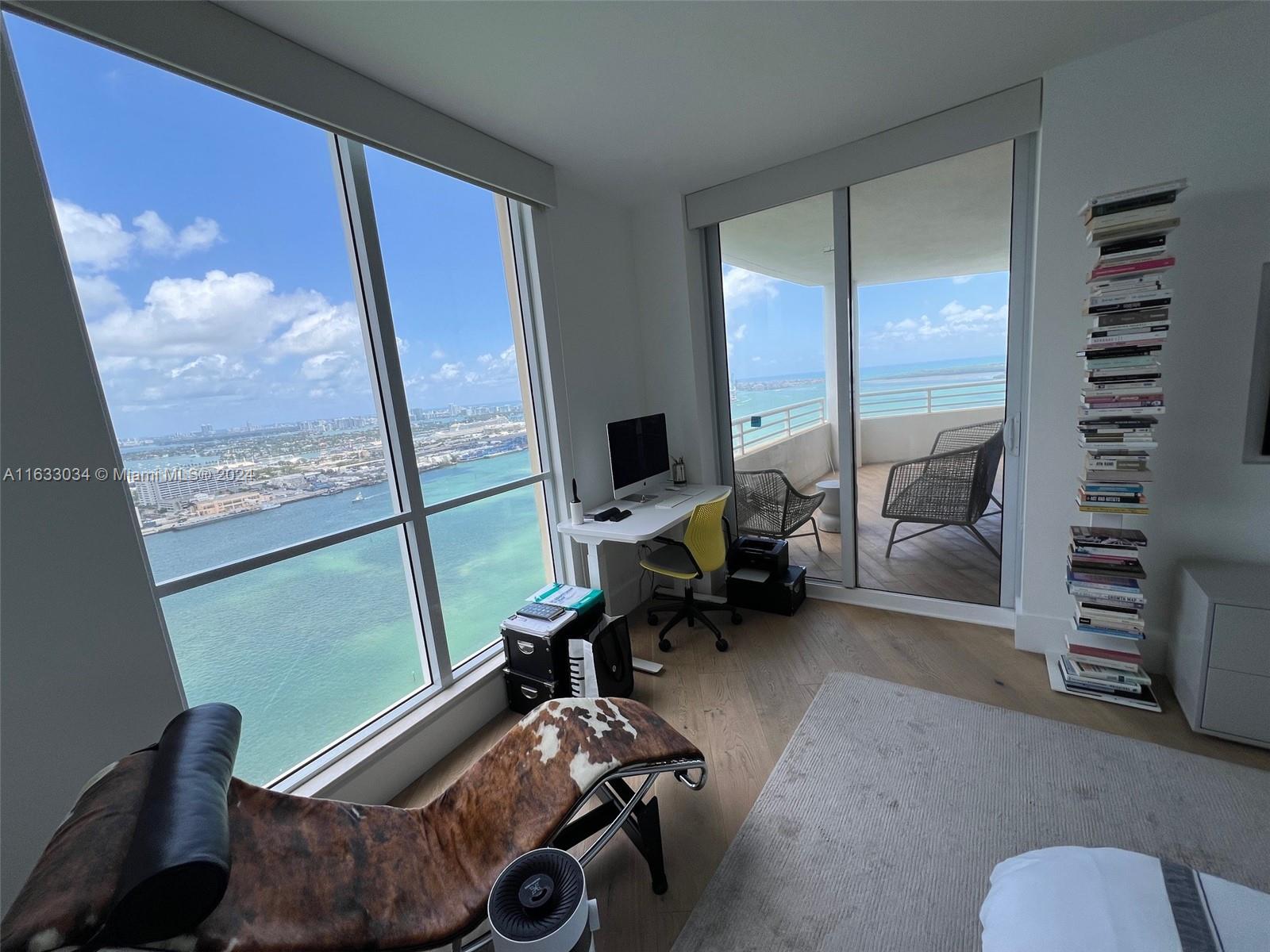 848 Brickell Key Drive, Unit 3701 Miami, FL 33131 - Photo 35 of 84 a view of a workspace with furniture and a window