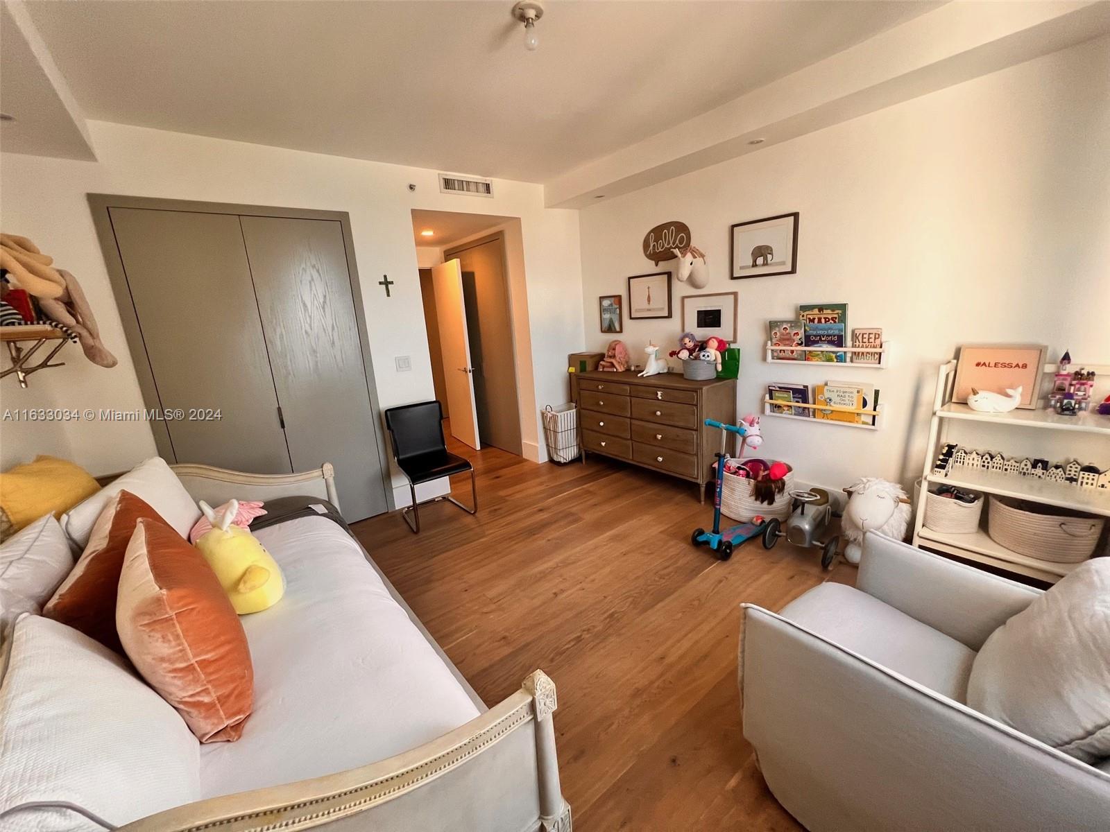 848 Brickell Key Drive, Unit 3701 Miami, FL 33131 - Photo 57 of 84 a living room with furniture and a flat screen tv