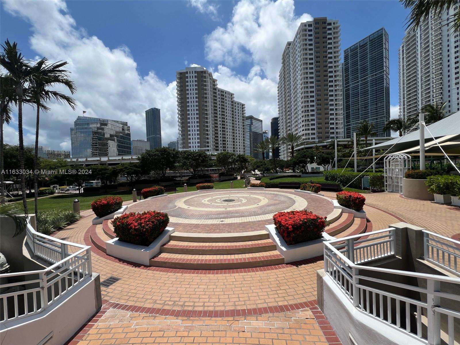 848 Brickell Key Drive, Unit 3701 Miami, FL 33131 - Photo 74 of 84 a view of a patio with couches and a fire pit