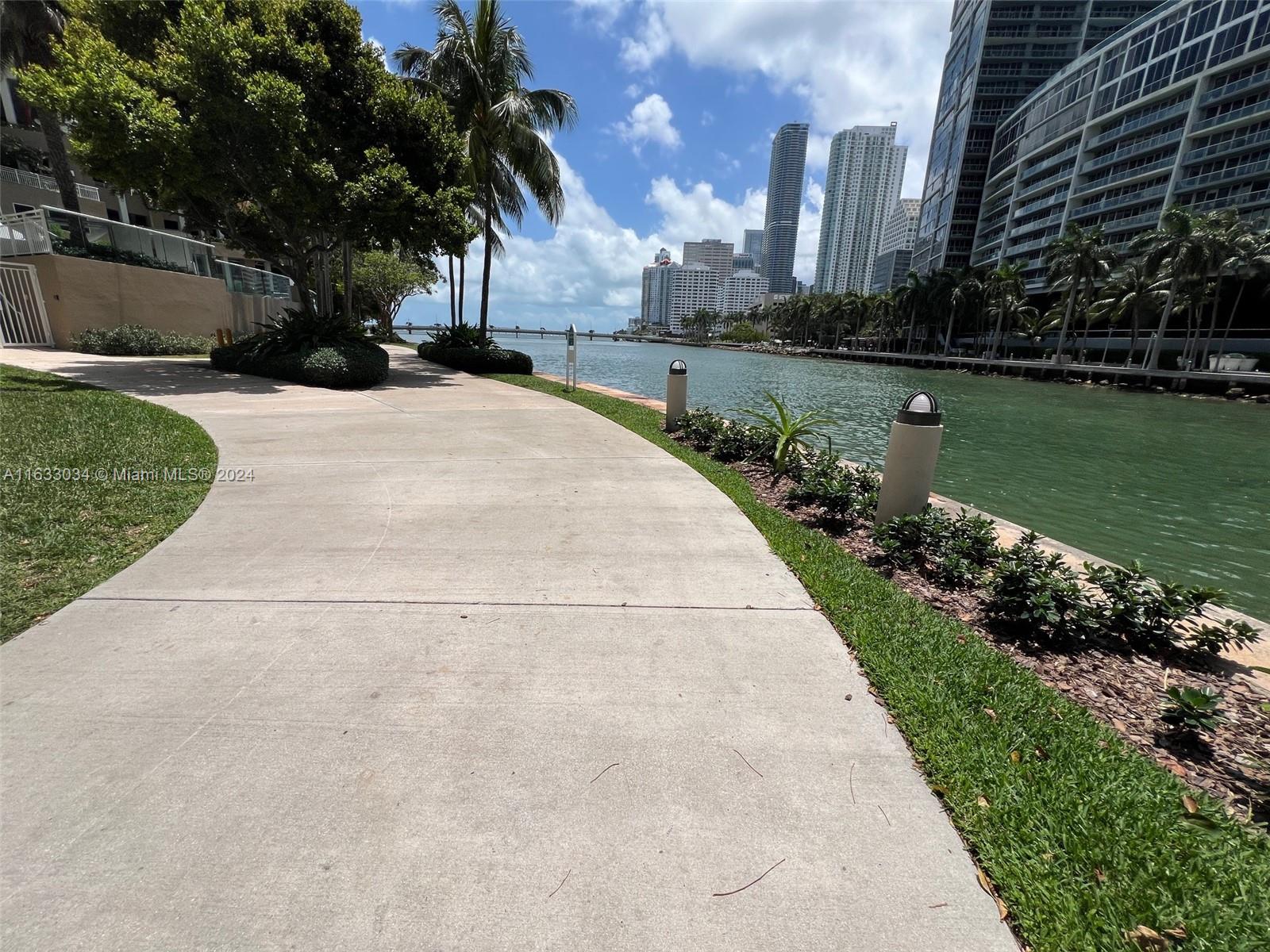 848 Brickell Key Drive, Unit 3701 Miami, FL 33131 - Photo 83 of 84 a view of a garden with a building in the background