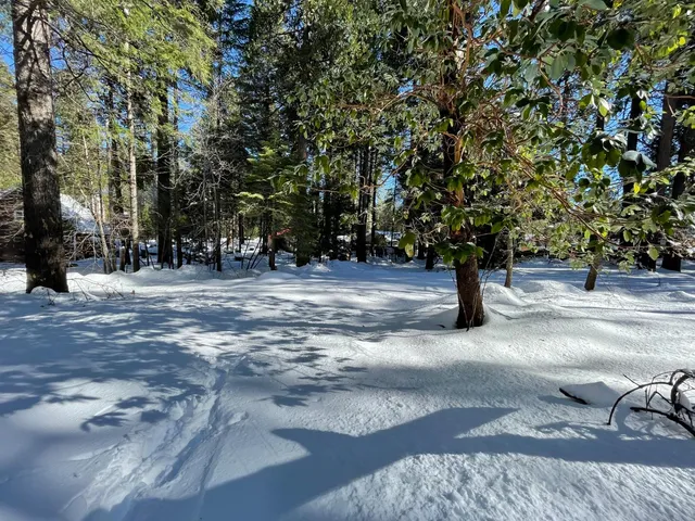 a sign board with yard in the back