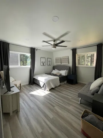 a bedroom with furniture and a window