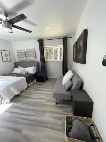 a bedroom with a bed and window