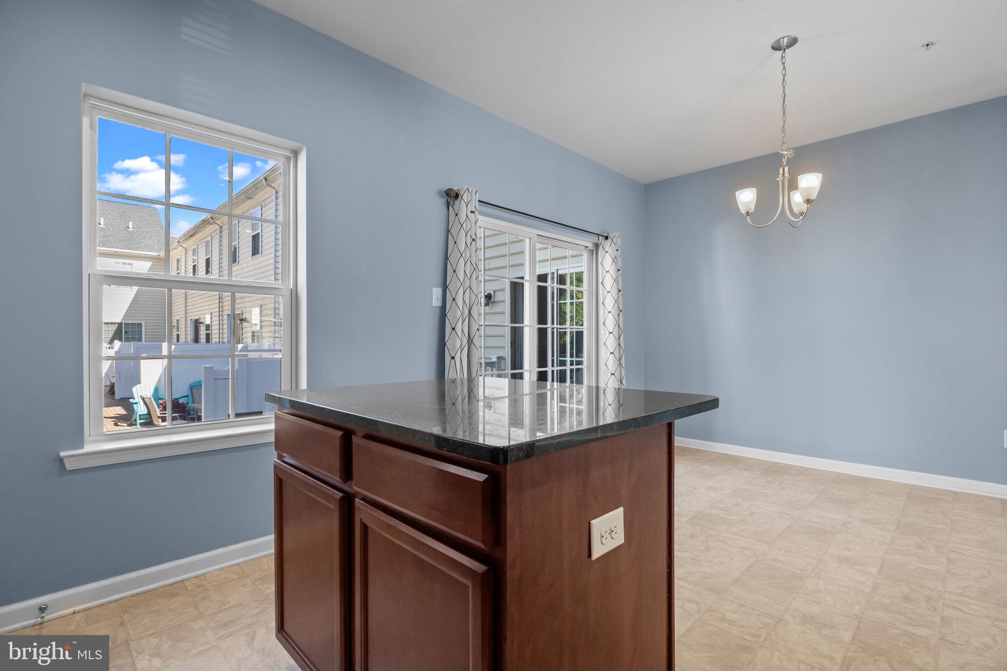 3753 Jacob Stout Road, Unit 3 Doylestown, PA 18902 - Photo 13 of 34 a kitchen with stainless steel appliances granite countertop a stove a sink and a window