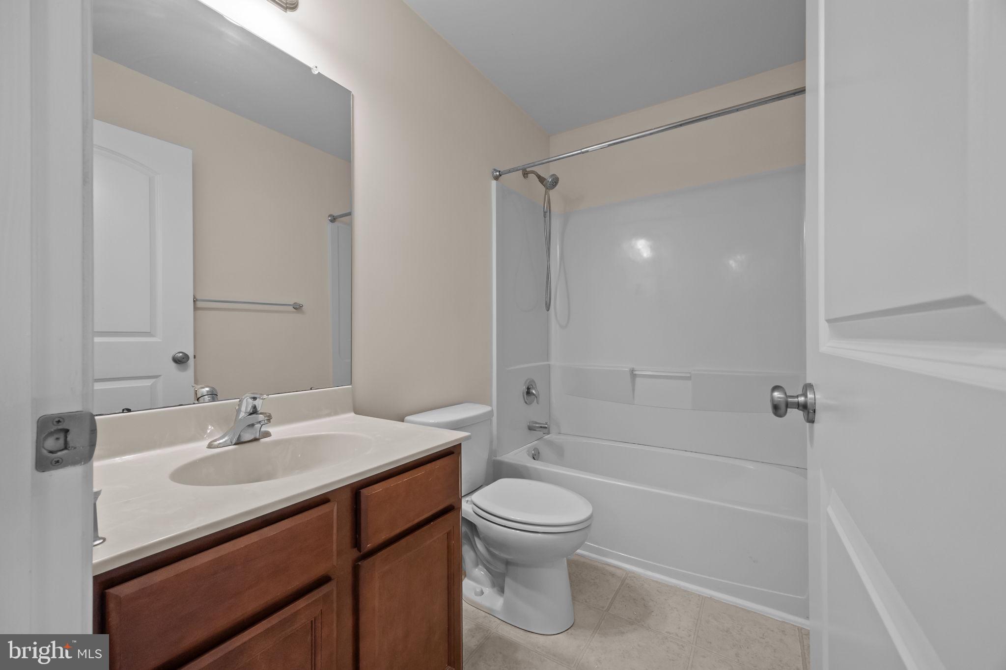 3753 Jacob Stout Road, Unit 3 Doylestown, PA 18902 - Photo 17 of 34 a bathroom with a sink a toilet and shower