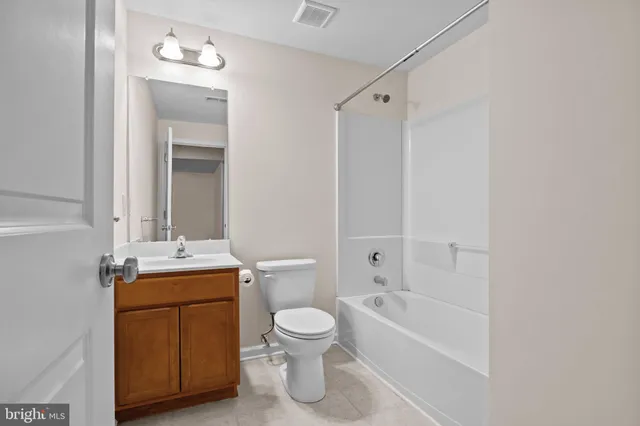 a view of a patio with table and chairs and potted plants