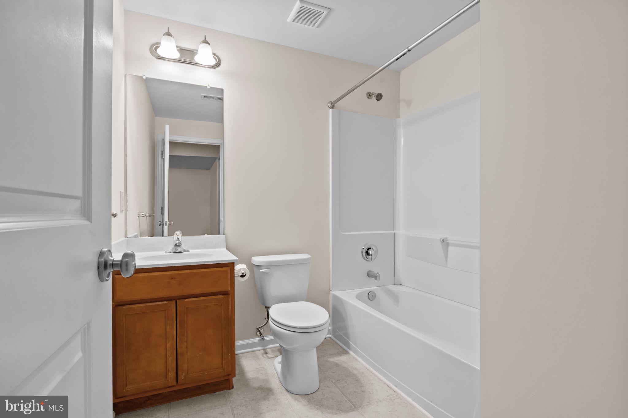 3753 Jacob Stout Road, Unit 3 Doylestown, PA 18902 - Photo 29 of 34 a bathroom with a toilet sink vanity tub and shower