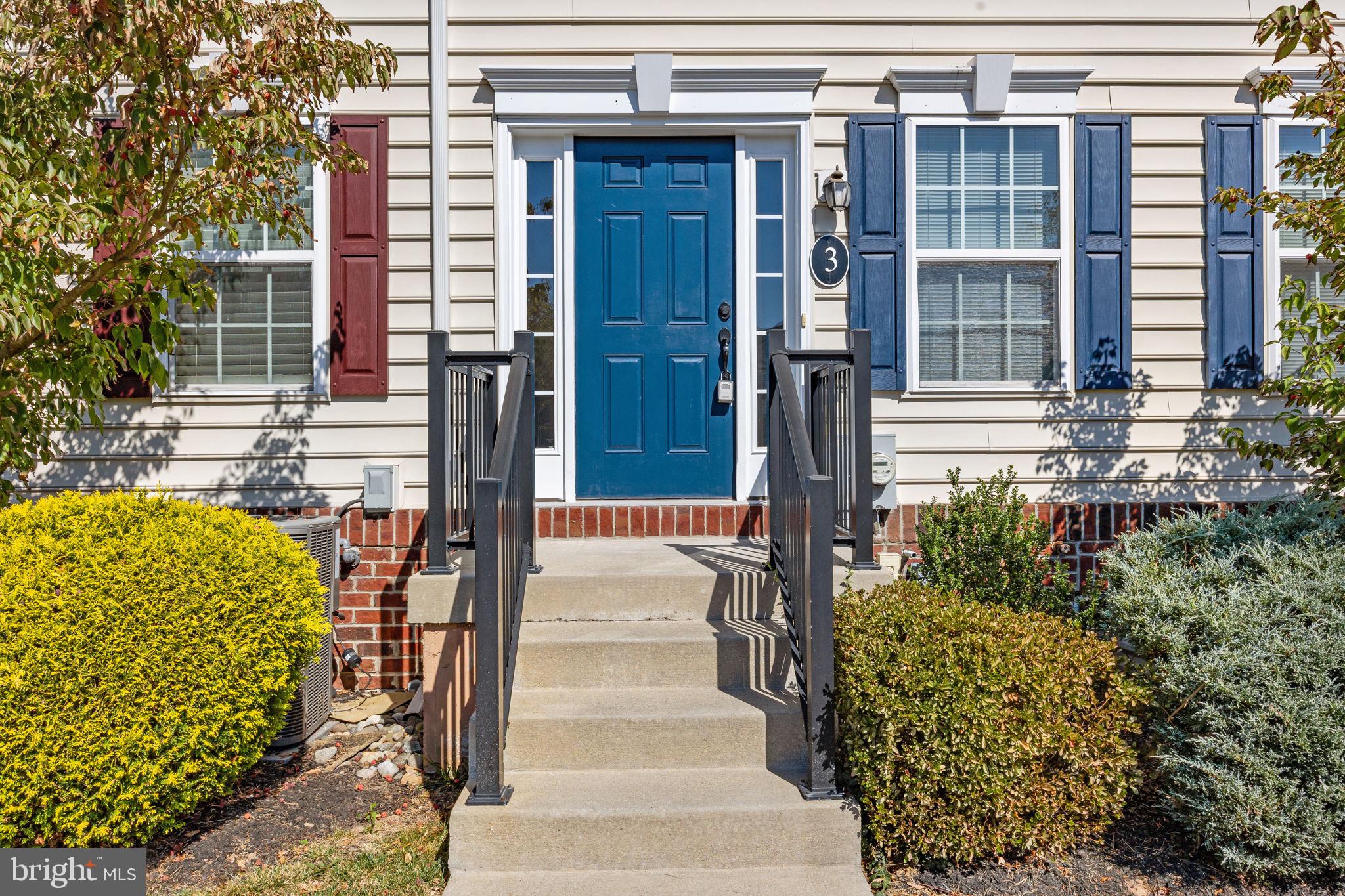 3753 Jacob Stout Road, Unit 3 Doylestown, PA 18902 - Photo 3 of 34 a front view of a house with a garden