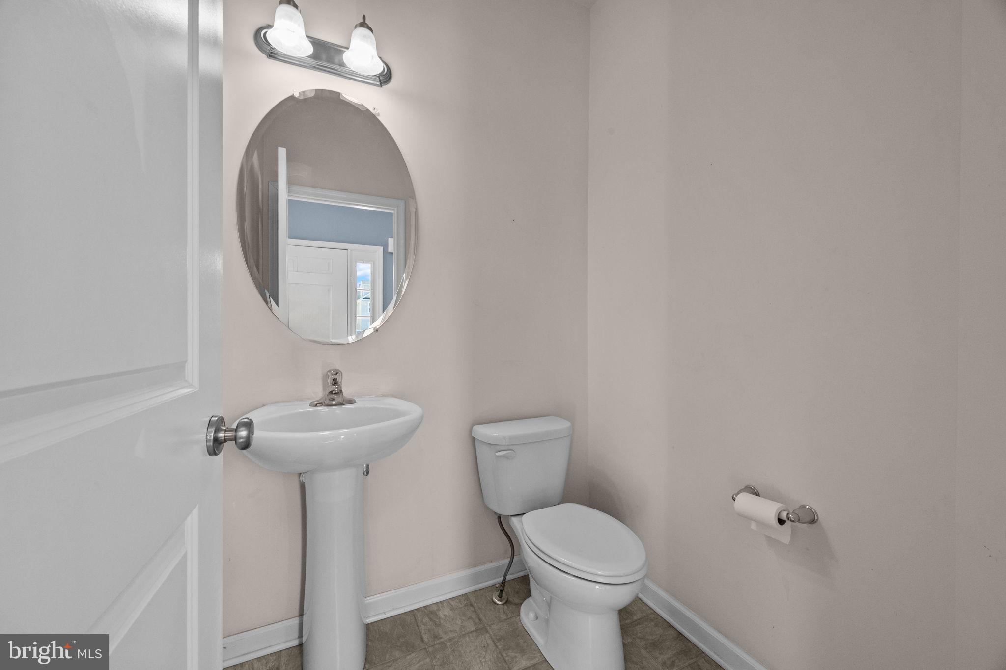 3753 Jacob Stout Road, Unit 3 Doylestown, PA 18902 - Photo 5 of 34 a bathroom with a toilet sink and mirror