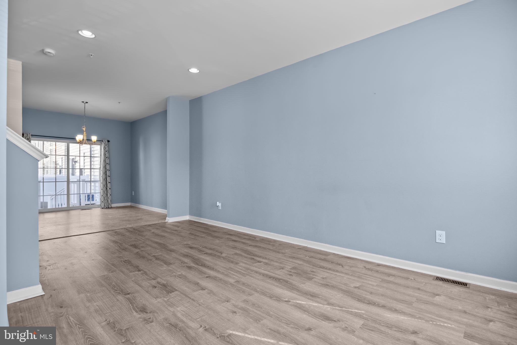 3753 Jacob Stout Road, Unit 3 Doylestown, PA 18902 - Photo 6 of 34 an empty room with wooden floor and windows