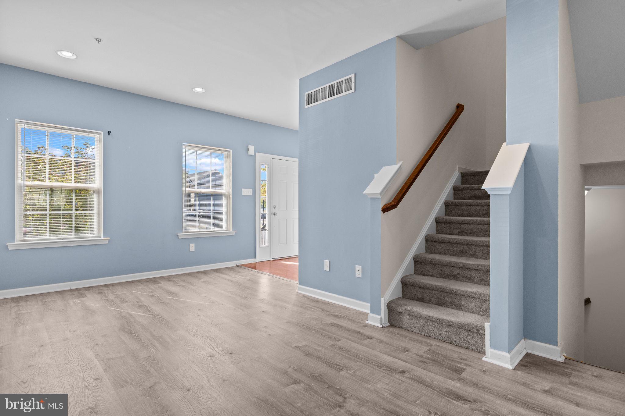 3753 Jacob Stout Road, Unit 3 Doylestown, PA 18902 - Photo 8 of 34 a view of an empty room with wooden floor and stairs
