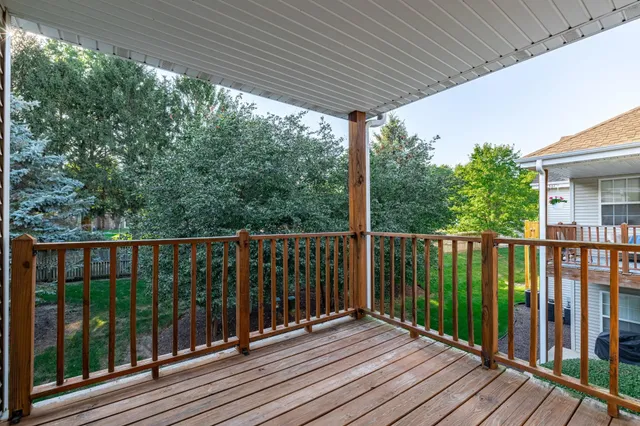 a view of a balcony with wooden floor