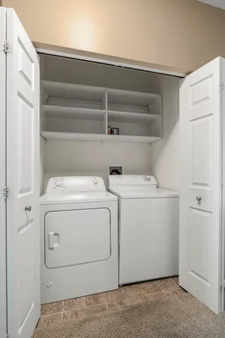 a view of a white house with a outdoor space