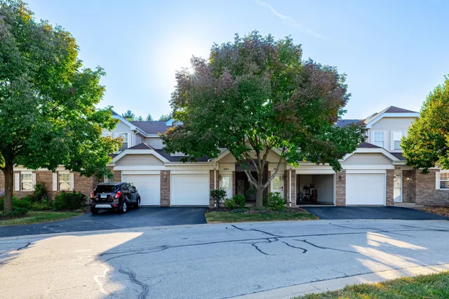 a car parked in front of white house