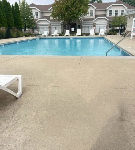 a view of a lake with a building and a big yard
