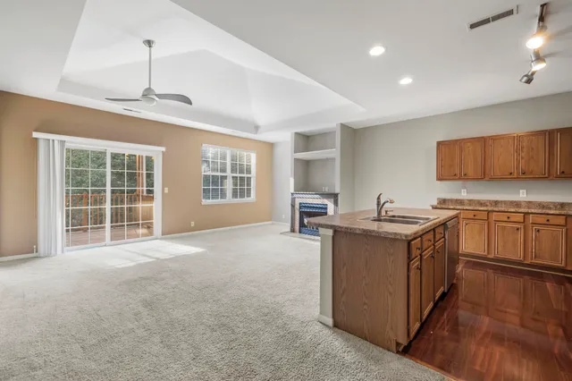a kitchen with stainless steel appliances granite countertop a stove and a sink
