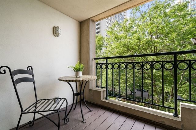 a view of a balcony with chairs