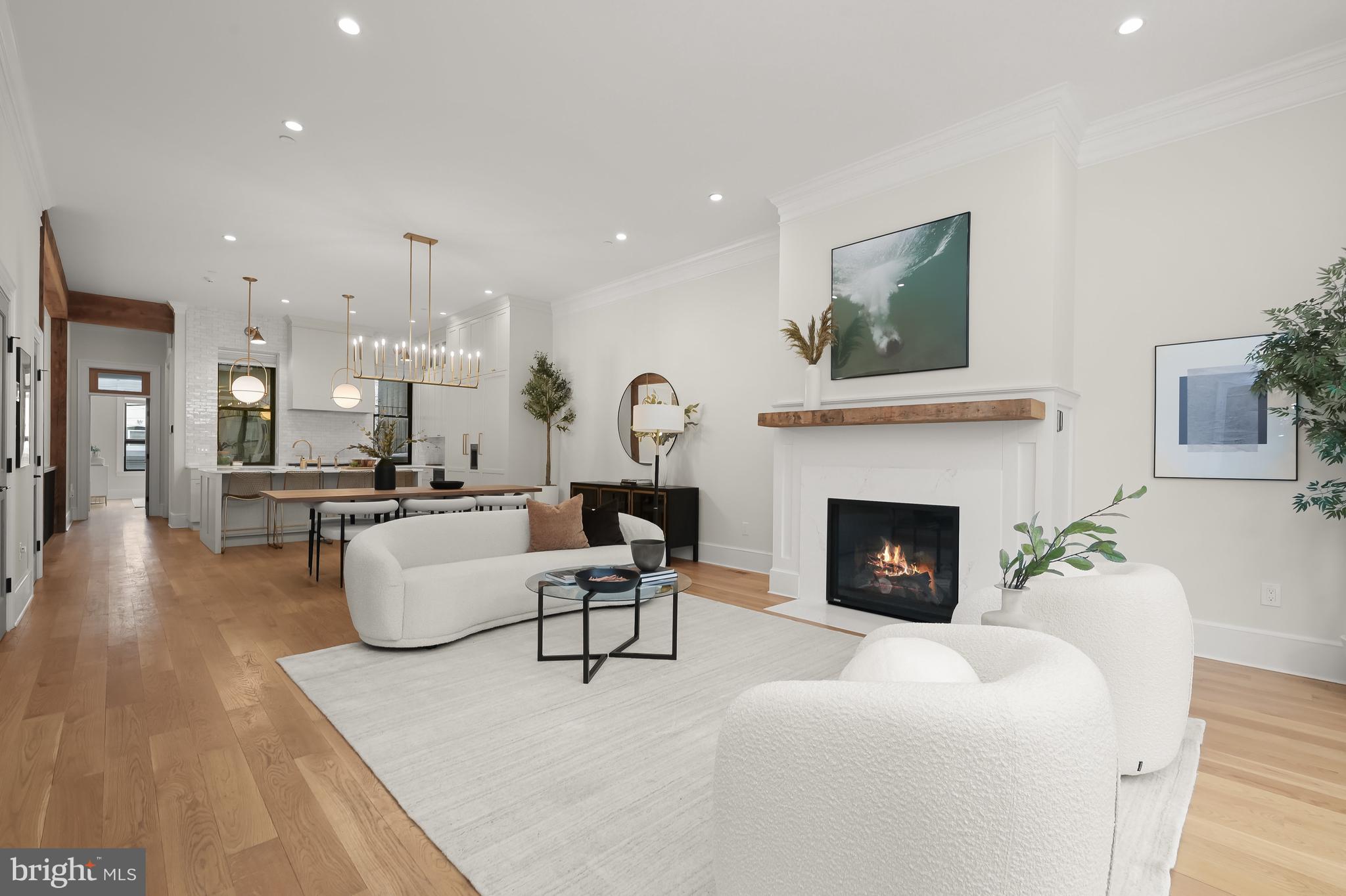 Open Living, Dining, and Kitchen with adjacent Pow
