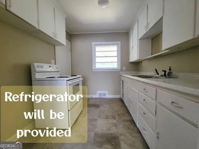 a kitchen with kitchen island granite countertop a stove