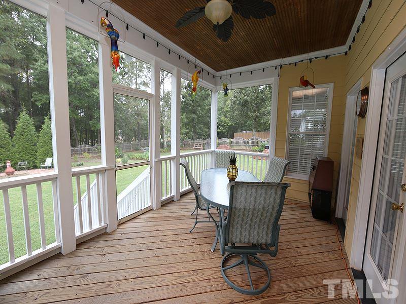 9009 New Century Road Wake Forest, NC 27587 - Photo 14 of 17 Fabulous screened porch overlooks open and well landscaped backyard. Come enjoy the view!
