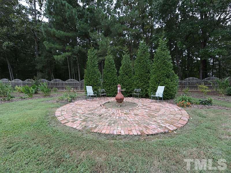 9009 New Century Road Wake Forest, NC 27587 - Photo 15 of 17 Brick Paver area is perfect for your fit pit or chiminea!
