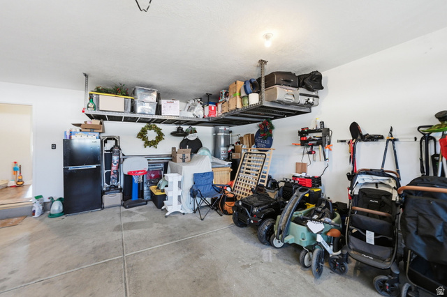 1175 Silver Hollow Road Syracuse, UT 84075 - Photo 28 of 34 Garage featuring concrete flooring and overhead steel shelving