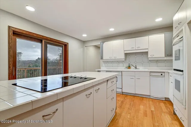 a bathroom with a sink a bathtub and shower