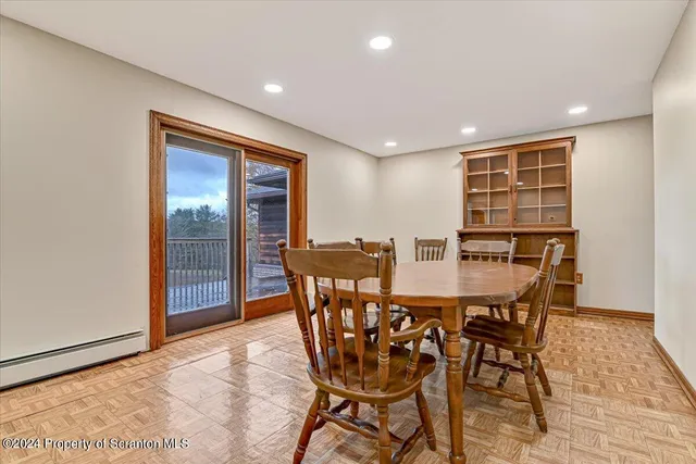 a white toilet sitting next to a white sink