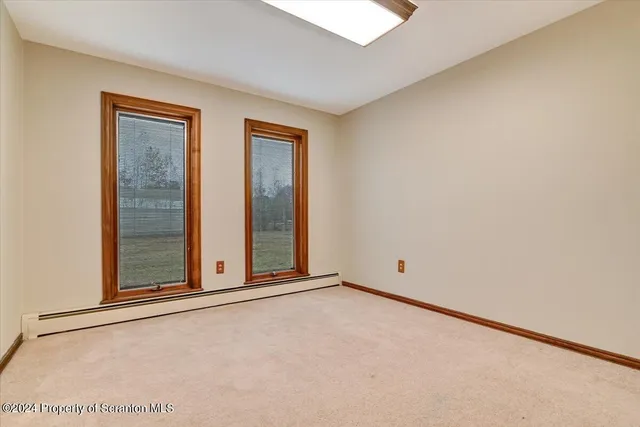 a kitchen with stainless steel appliances kitchen island granite countertop a sink and cabinets