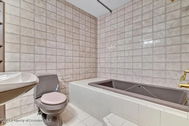 a view of storage and utility room with two washing machine