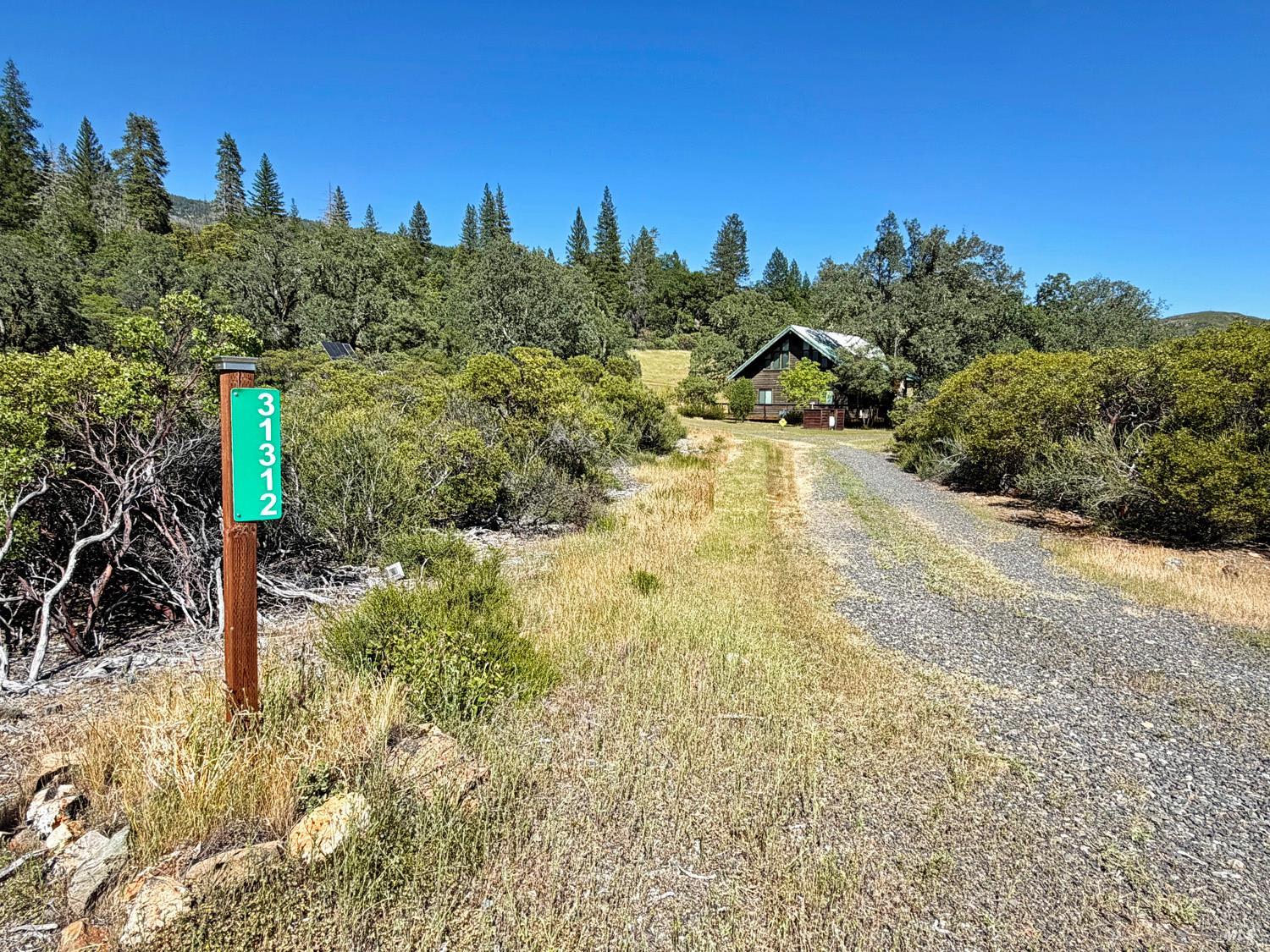31312 High Point Road Potter Valley, CA 95469 - Photo 44 of 58 a view of a yard with a house in the background
