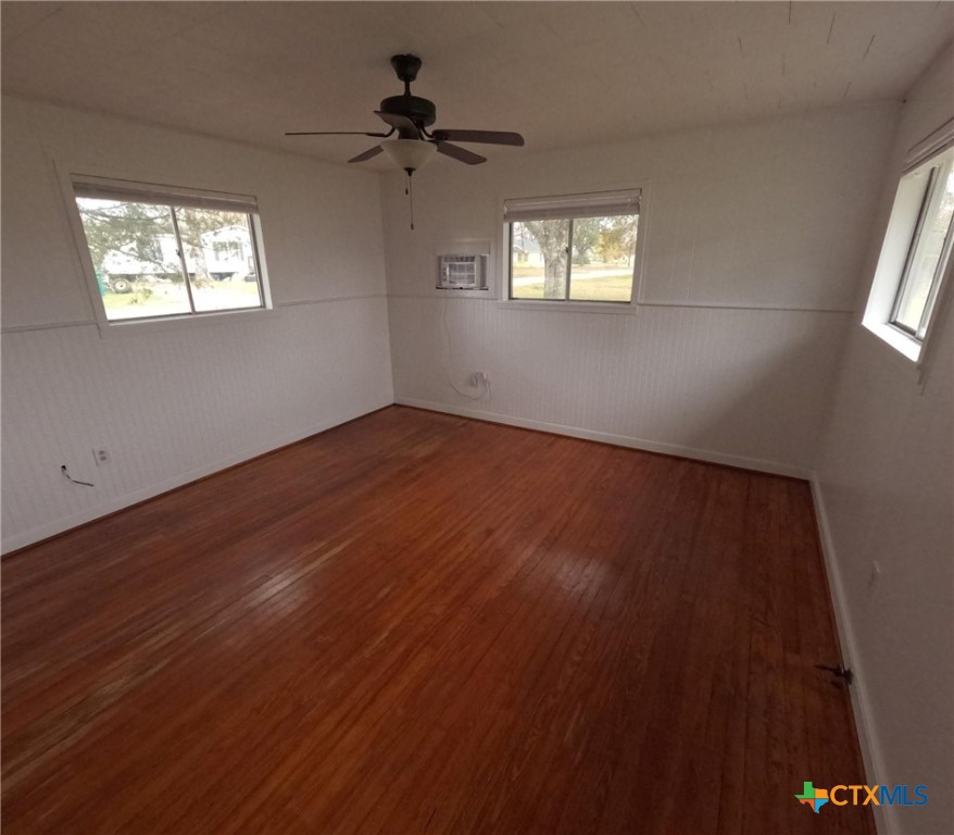 218 North 4th Ganado, TX 77962 - Photo 15 of 19 a view of an empty room with wooden floor and a window