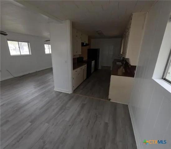 a view of a kitchen from the hallway